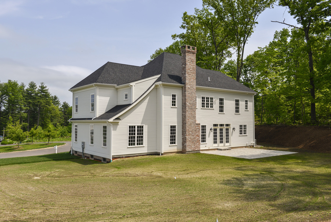 10 Taskers Pond — rear elevation, custom stonework and landscaping